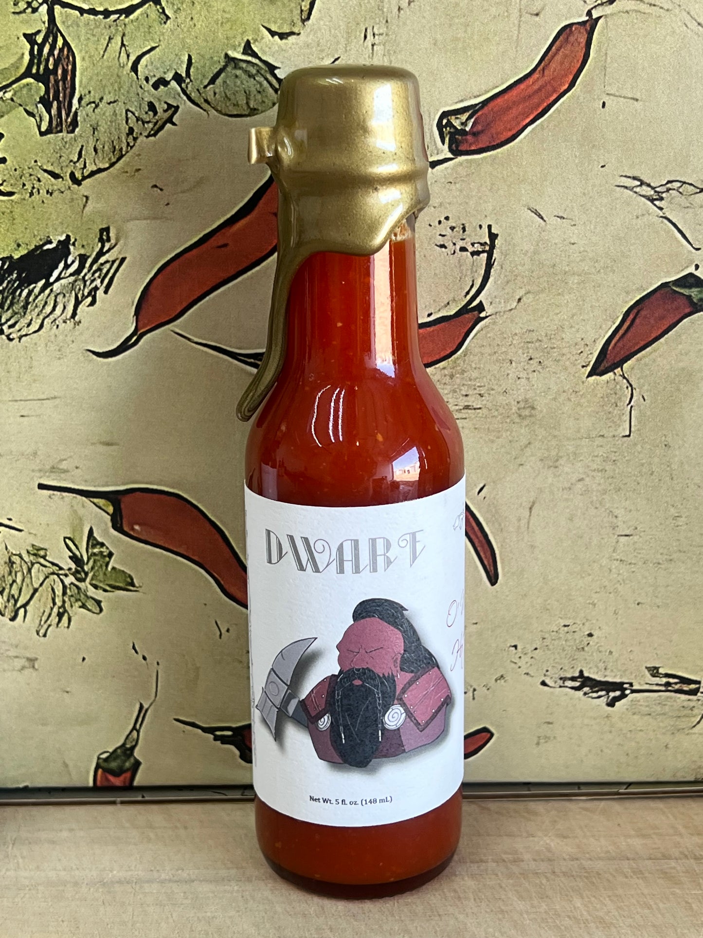 Red jalapeno sauce by O'Malley's with a bold, vibrant label